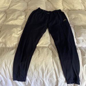Tracksmith track pants in navy blue